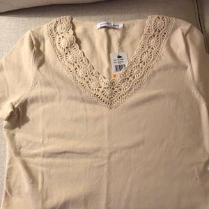 New Mercer Street Studio short-sleeved cream colored t-shirt, cut out neckline.